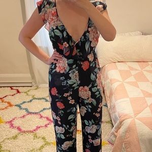 Yumi Kim Floral jumpsuit romper with cross back and flutter straps